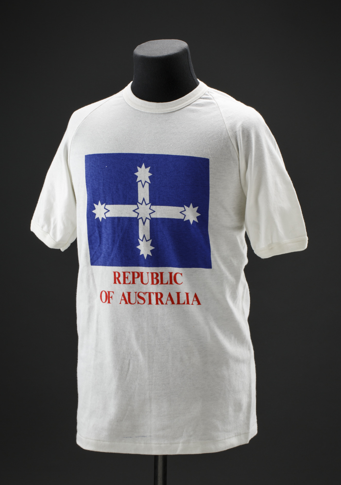 White t-shirt depicting the Eureka flag, with ‘REPUBLIC OF AUSTRALIA’ printed below in red.