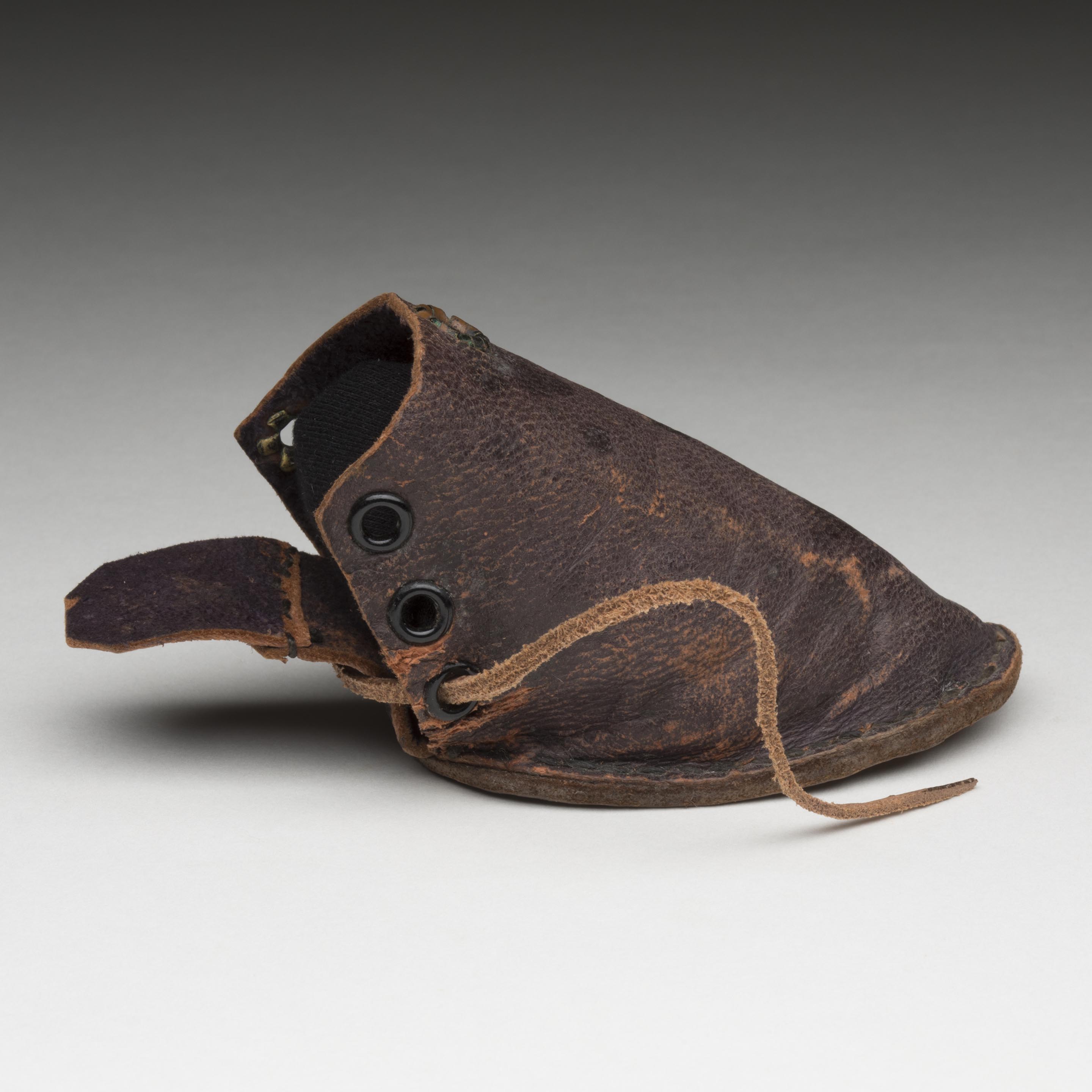 Leather dog shoe worn on long bush walking trips in the Blue Mountains by the Dunphy's fox terrier named Dextre.