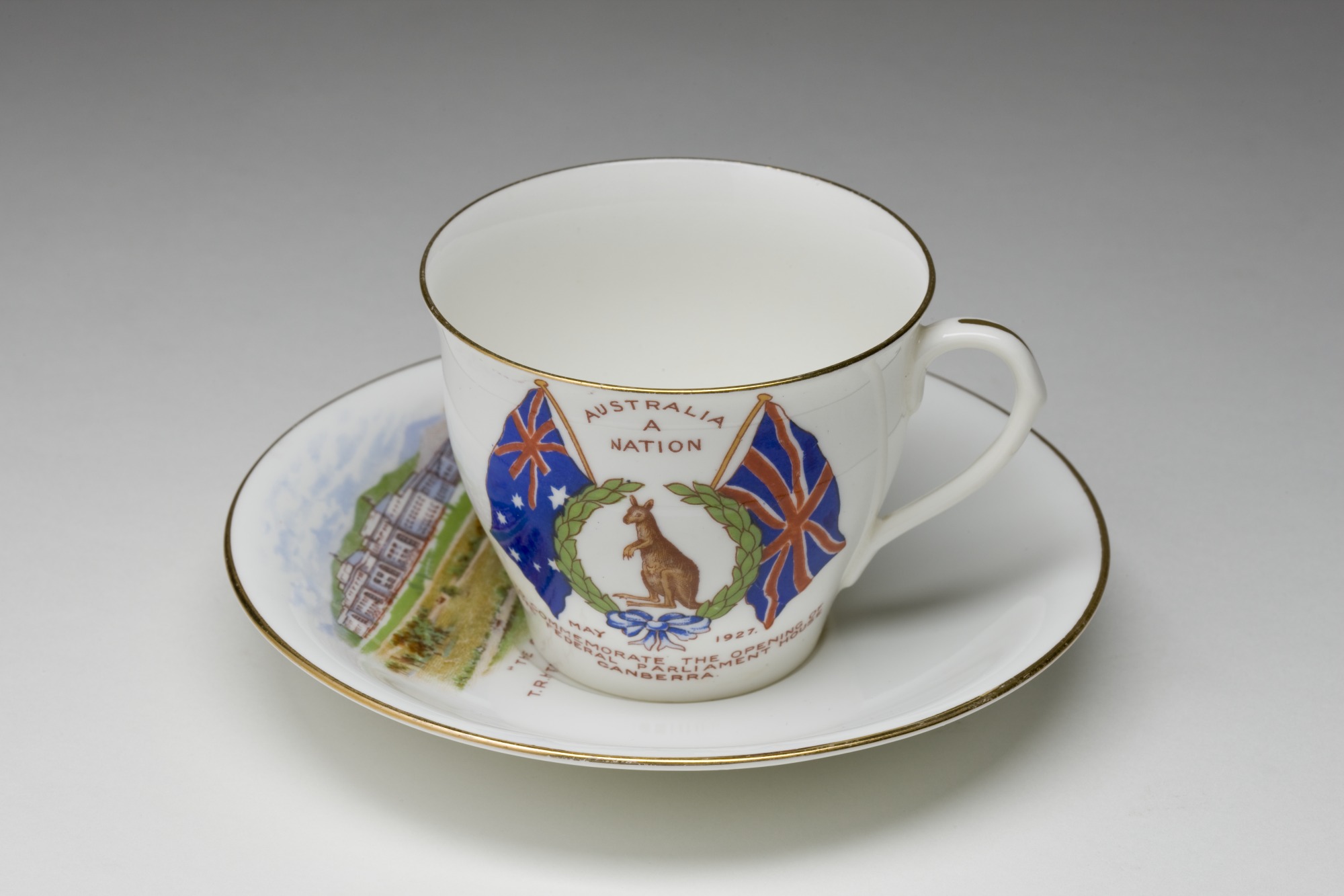 Souvenir white china cup and saucer commemorating the opening of Parliament House, Canberra, 9 May 1927.