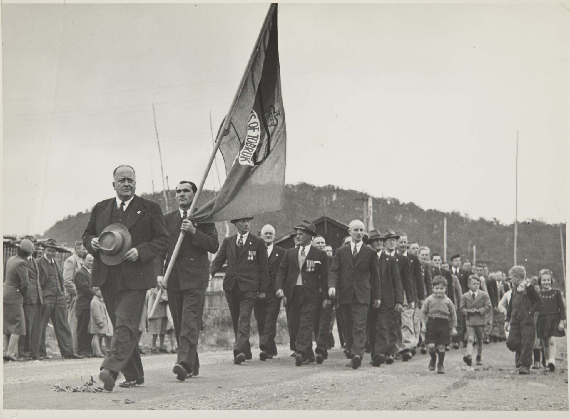 Men marching on Anzac Day, 1949. 