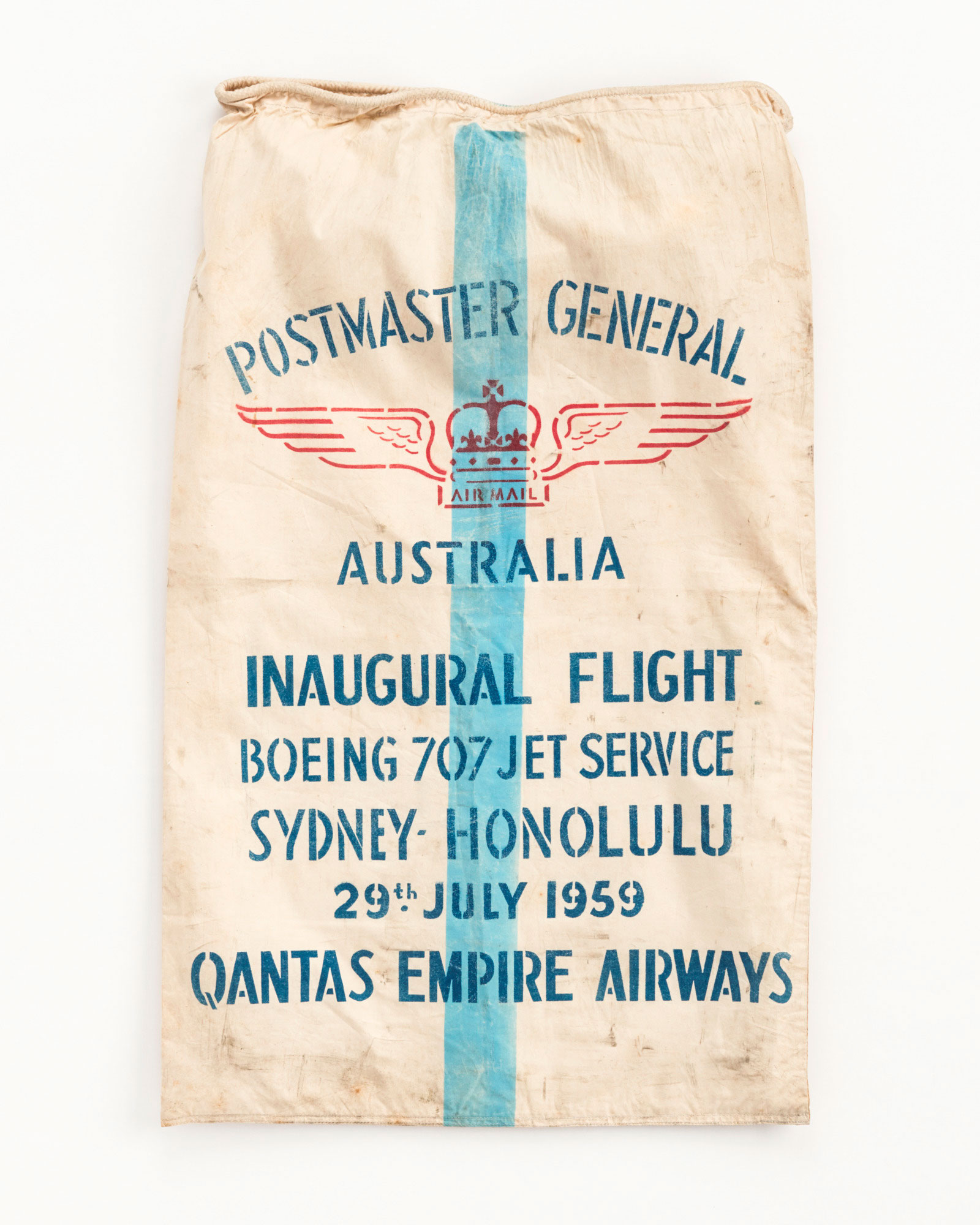 White canvas post bag celebrating the first Qantas flight between Sydney and Honolulu, 1959.