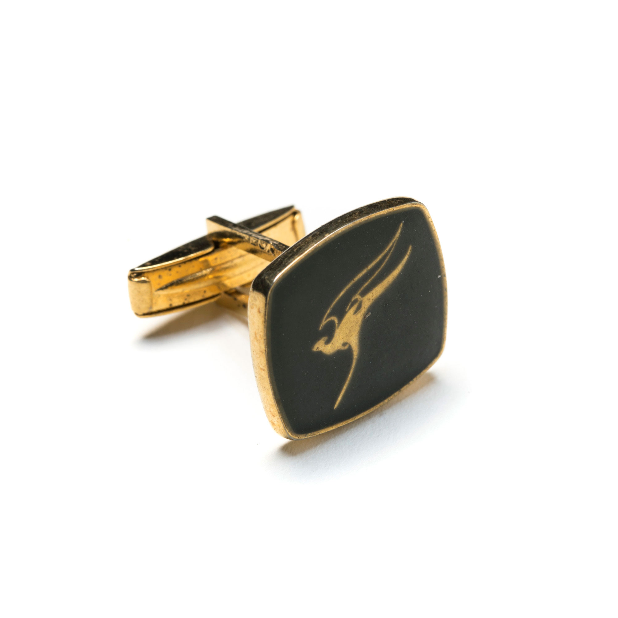 Cufflink with flying kangaroo Qantas logo.