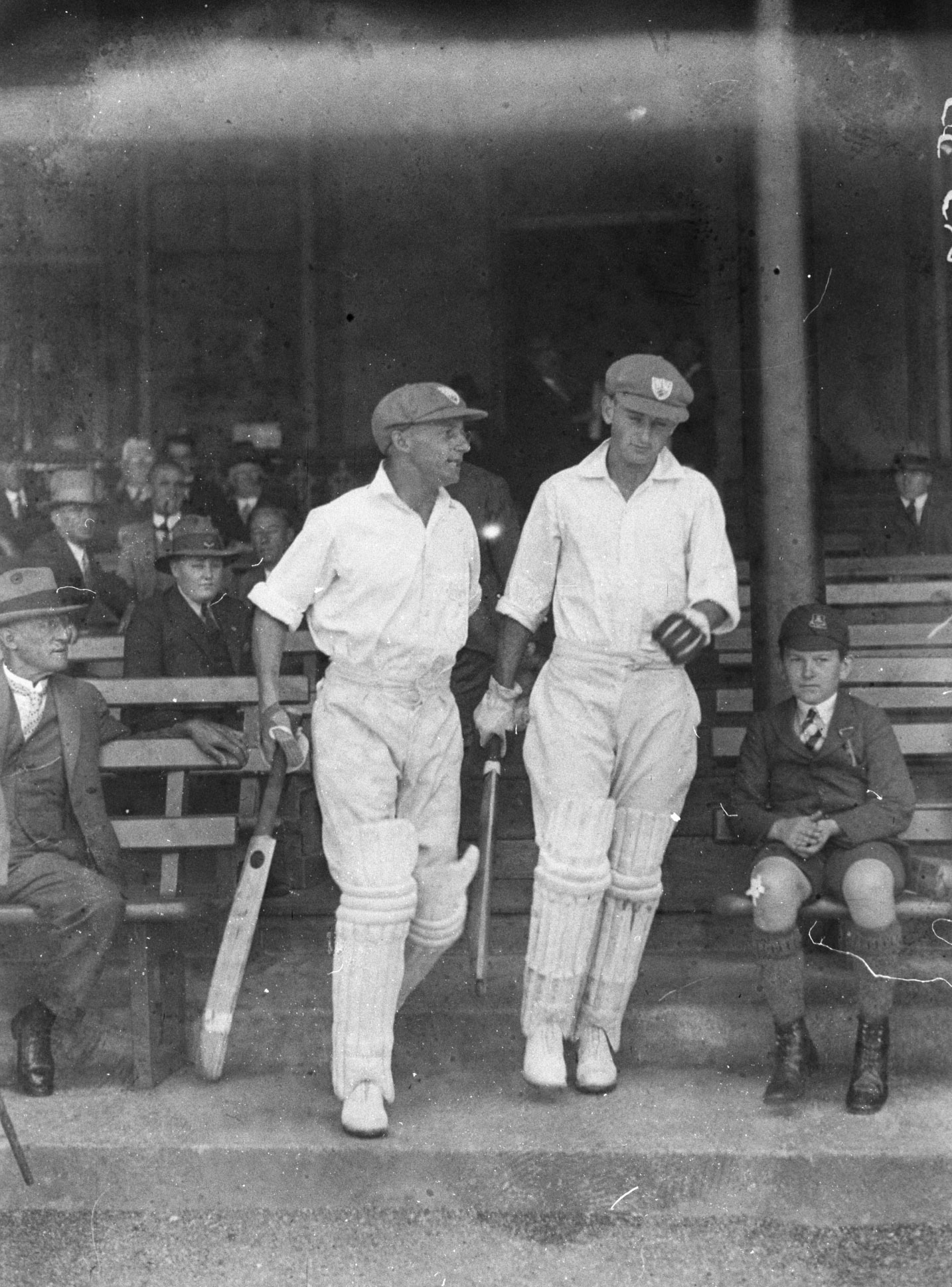 Don Bradman (left) and Stan McCabe take the field, 1932.