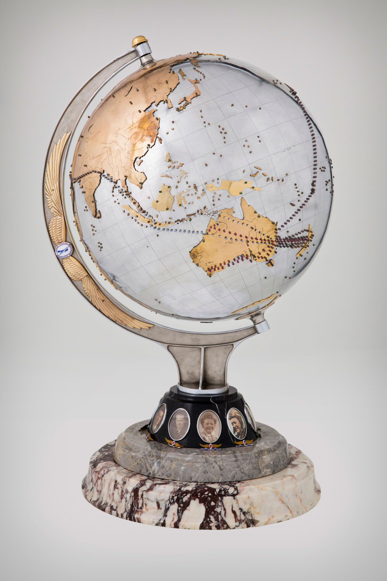 Metal globe studded with coloured stones marking the flight paths of the Charles Kingsford Smith airplane the Southern Cross.