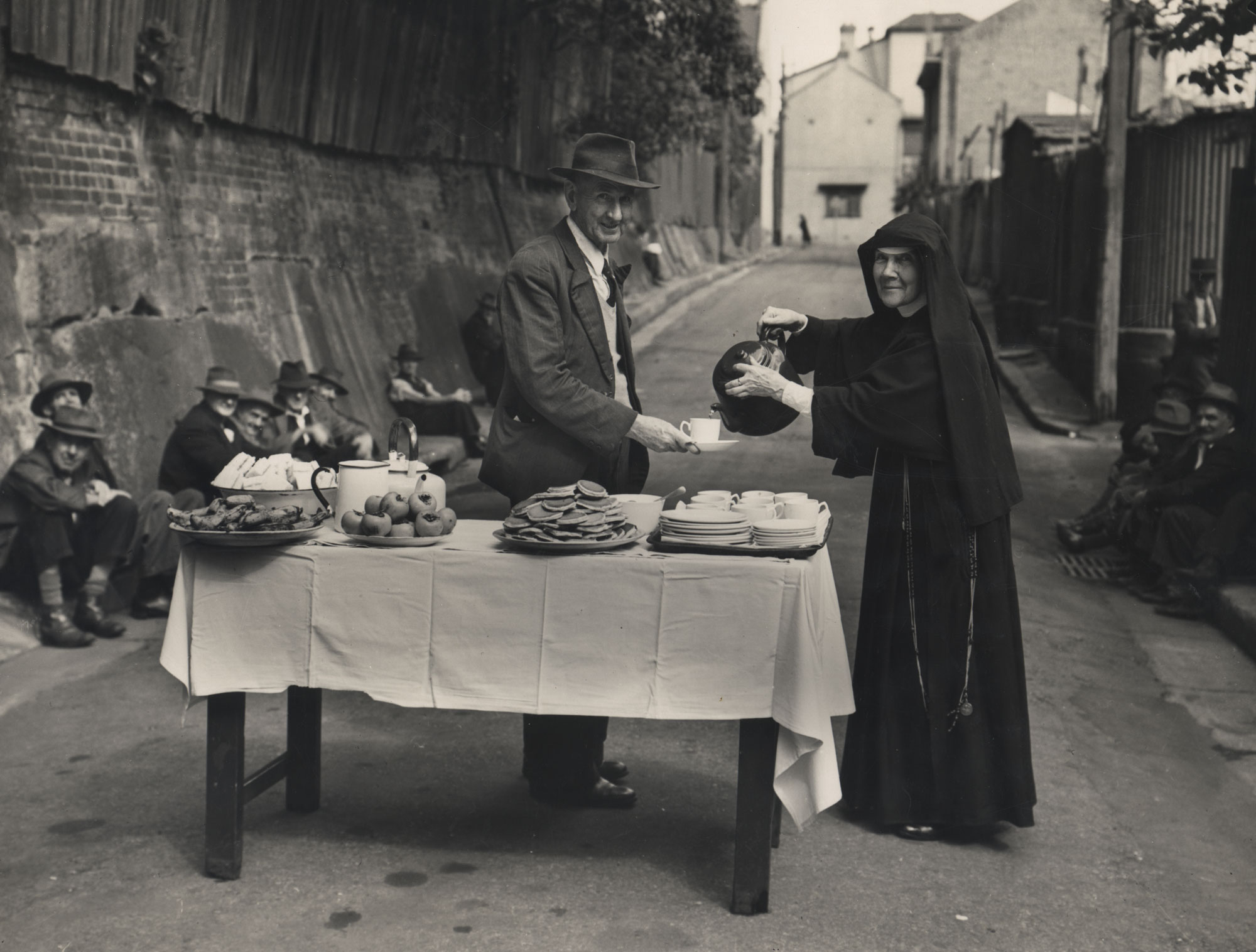 Sister Maurus Tierney, serving food to unemployed men during the Great Depression.