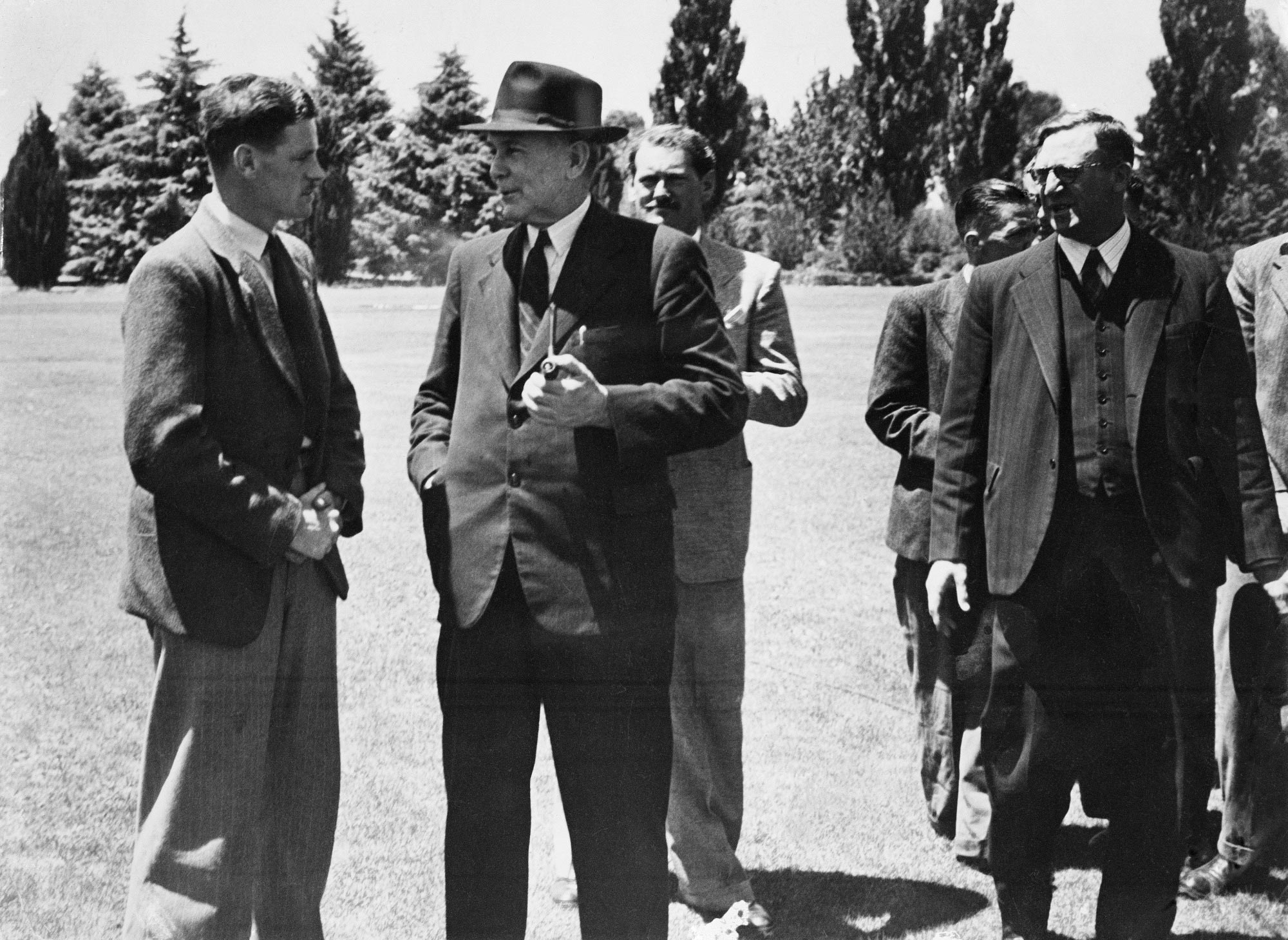 First assisted passage migrant from England, Tommy Smith, meets Prime Minister Ben Chifley and Arthur Calwell, 1947.