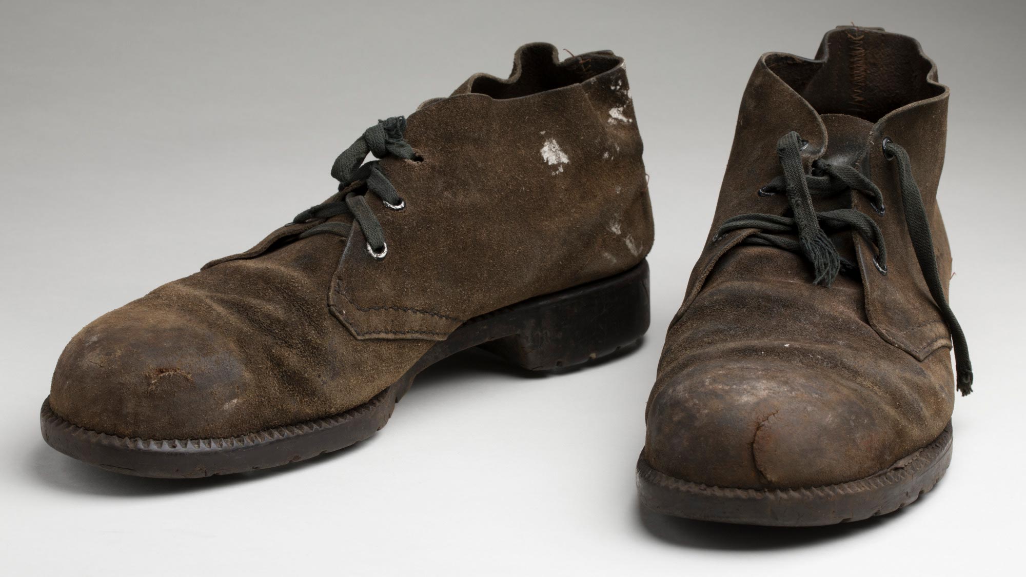Pair of ‘Desert Boot’ style shoes issued to and worn by Dutch immigrant dockside worker Harry Duyker, 1973 - 1985.