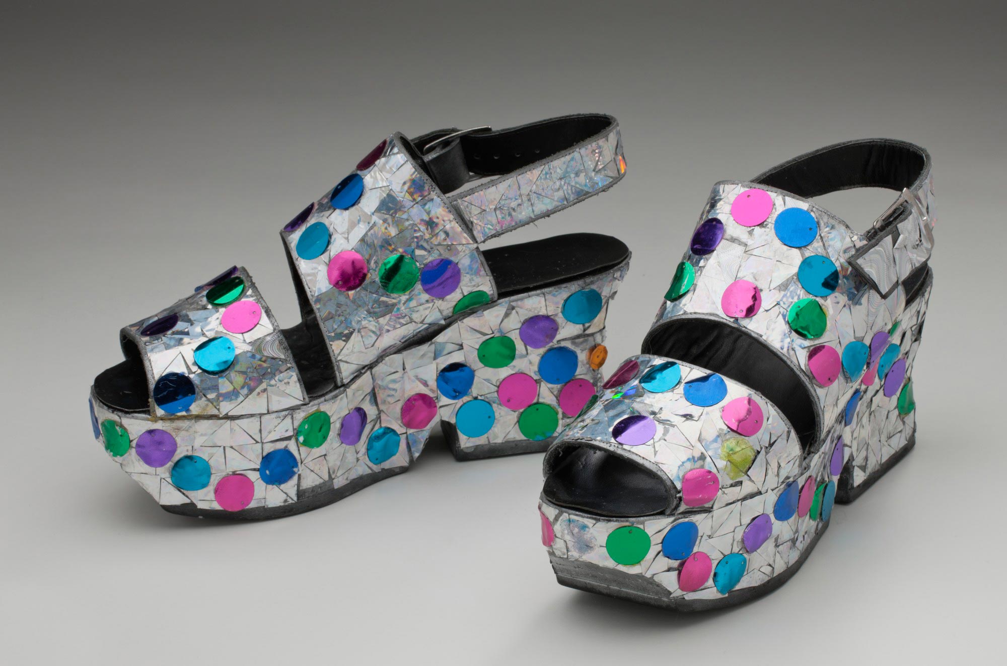 Pair of buckled sling back platform shoes with peek-a-boo toes.