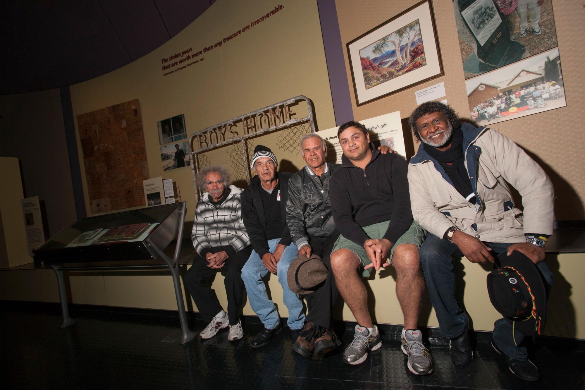 <p>Stolen Generations members Cecil Bowden, Manuel Ebsworth and Michael Welsh, accompanied by Jason Pitt and Pastor Ray Minniecon, in front of the gate from Kinchela Boys Home, at the National Museum of Australia, 7 June 2013</p>
