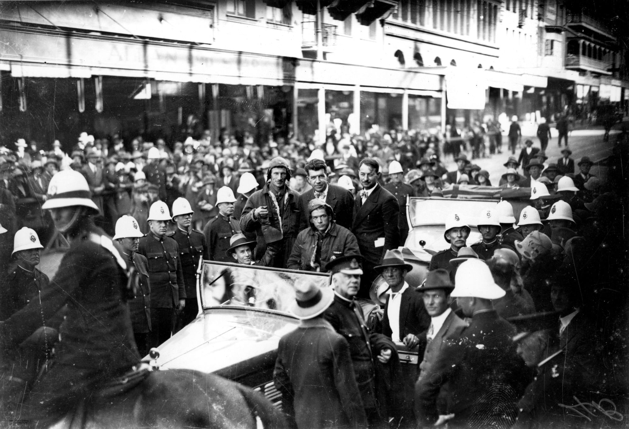Crowds line a Brisbane street to see Charles Kingsford Smith, 1928.