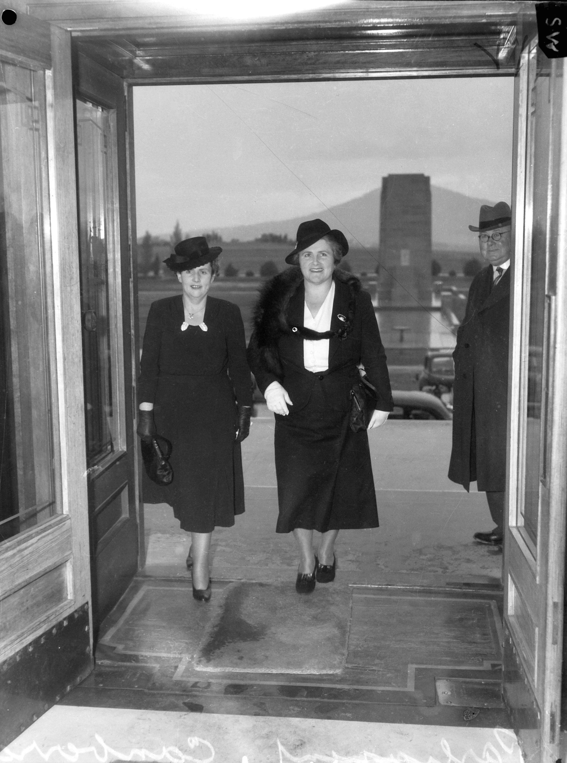 Dame Dorothy M. Tangney (left) and Dame Enid Lyons, GBE, entering the front door of the House of Representatives on 24 September 1943