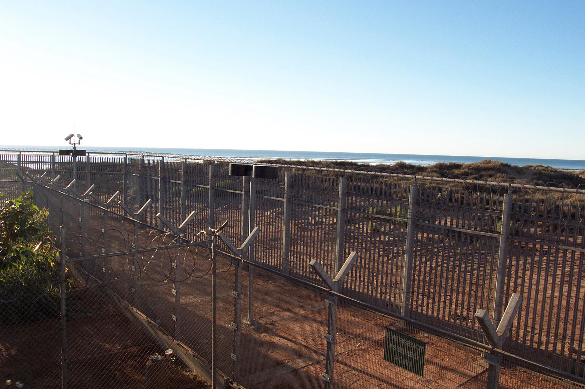 View through the fence at the Port Hedland Detention Centre.