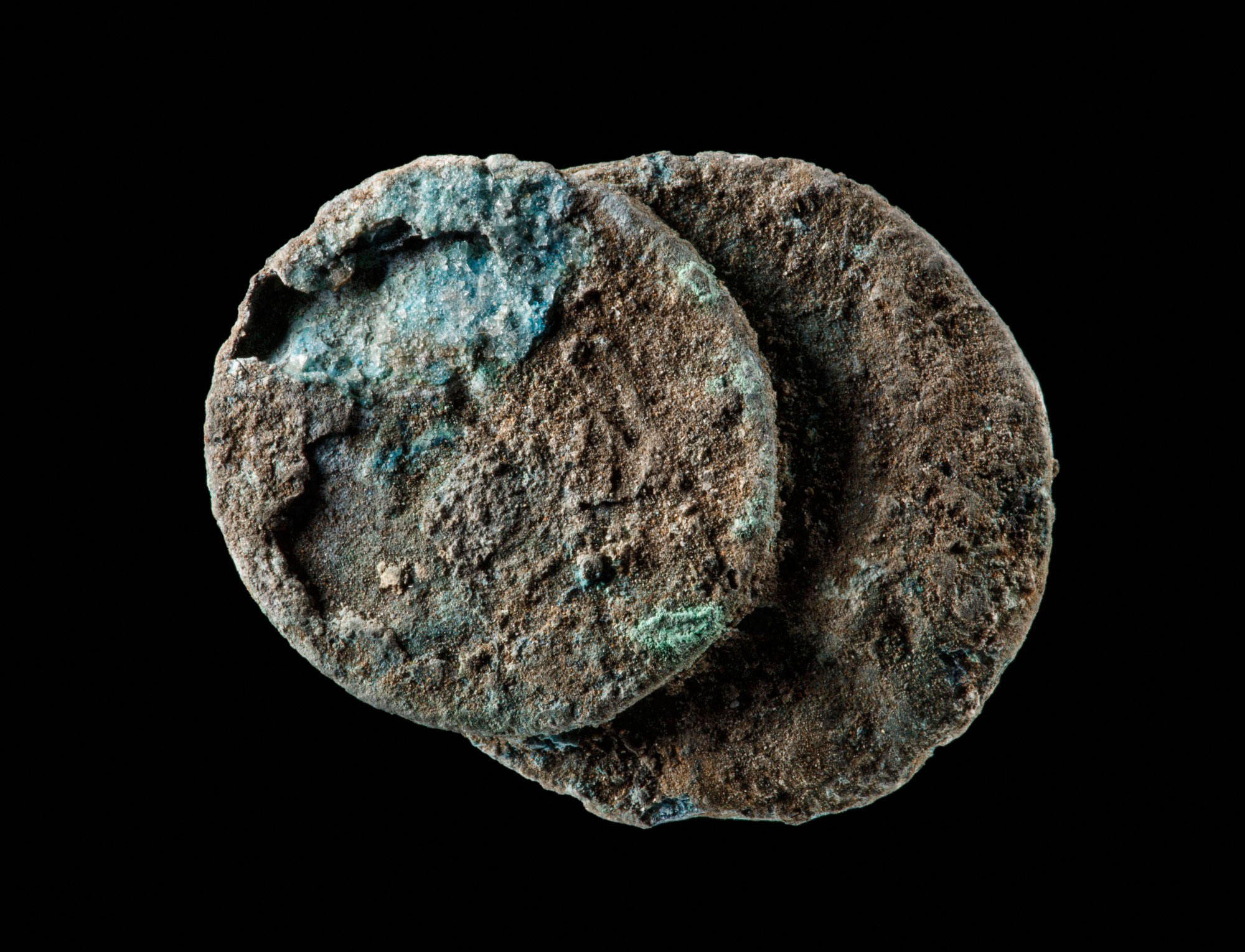 Four coins fused together, from Kilmore East bushfire, Victoria, 7 February 2009.