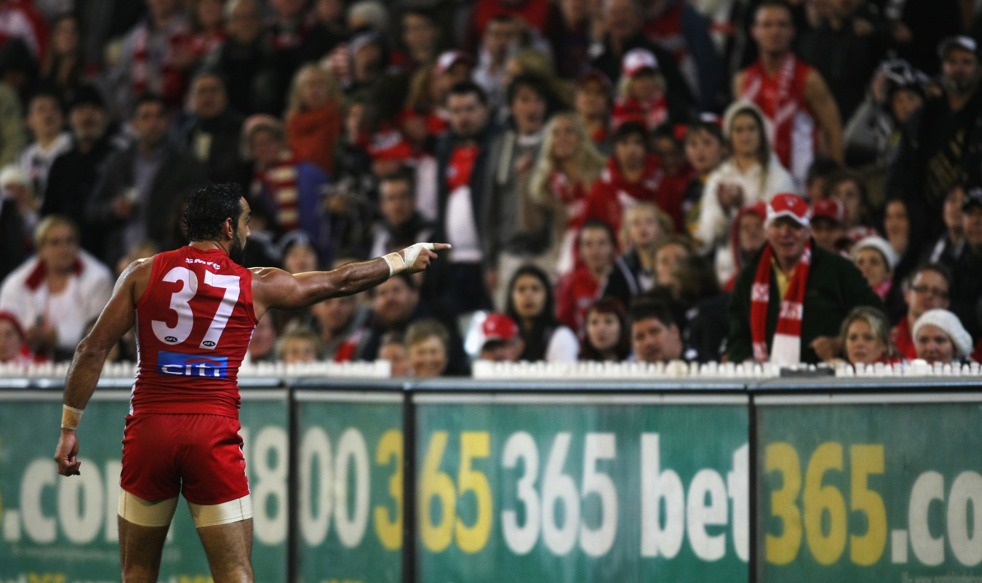 Adam Goodes points out a spectator who made racist comments about him, 24 May 2013.