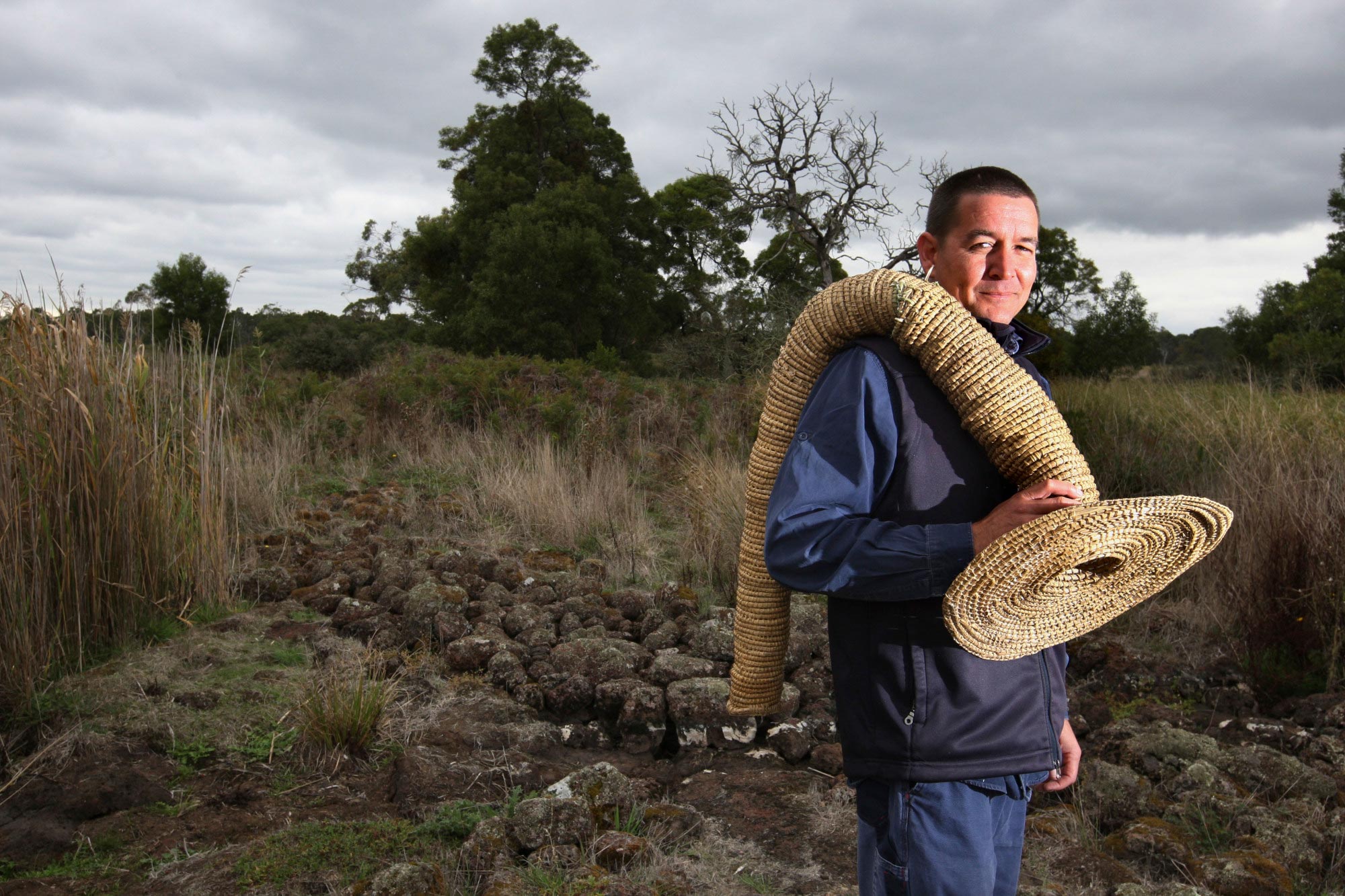 Budj Bim senior ranger Greg Shelton, carrying an eel trap, Australia's  Defining Moments Digital Classroom