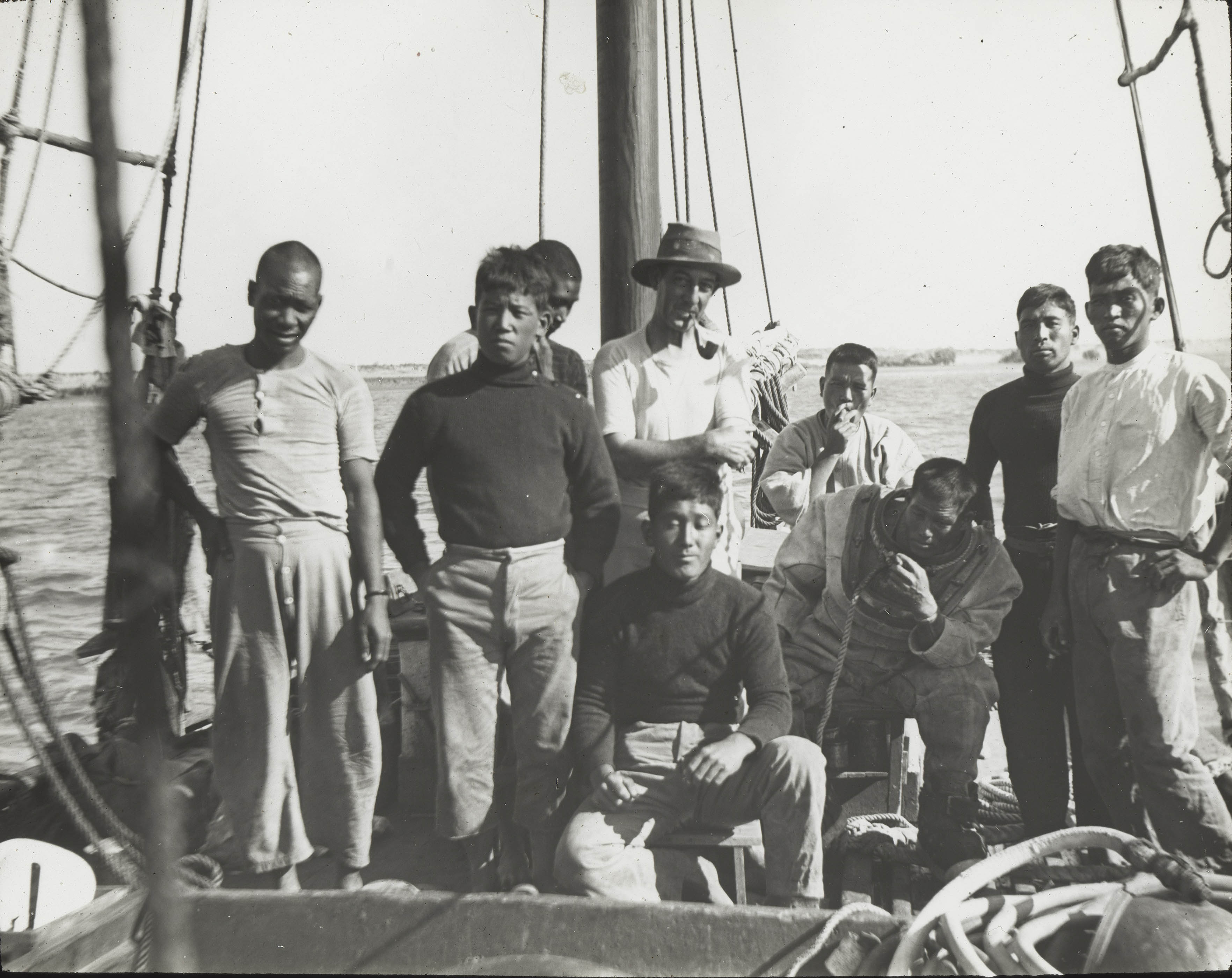 Japanese pearl divers with their Australian boat owner, Victor Kepert (wearing the hat), Broome, about 1914 or early 1920s.