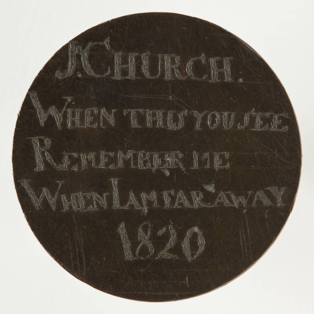 A convict love token, made up of a coin, engraved on both sides.