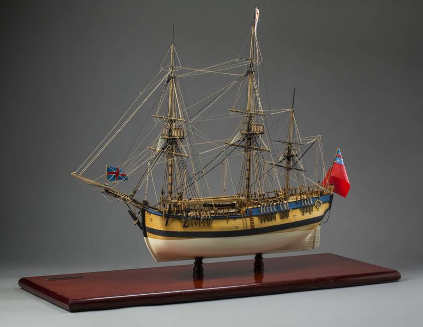 A finely-detailed 1:60 scale model of HM Barque 'Endeavour'. The model is timber-framed, fully-planked and rigged with wax cordage. It has handmade blocks with deck furniture and fixtures. It sits on a wooden base that has an engraved brass plaque that reads 'H.M. 'Endeavour' as she was rigged when she left Plymouth, England on 26 August 1768...' .