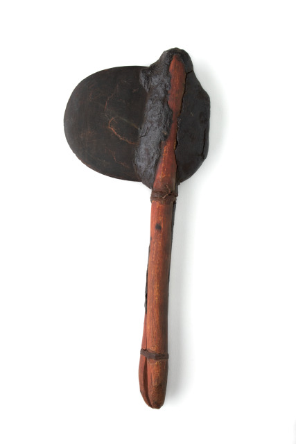 A hatchet with a wooden handle and a stone axe head.