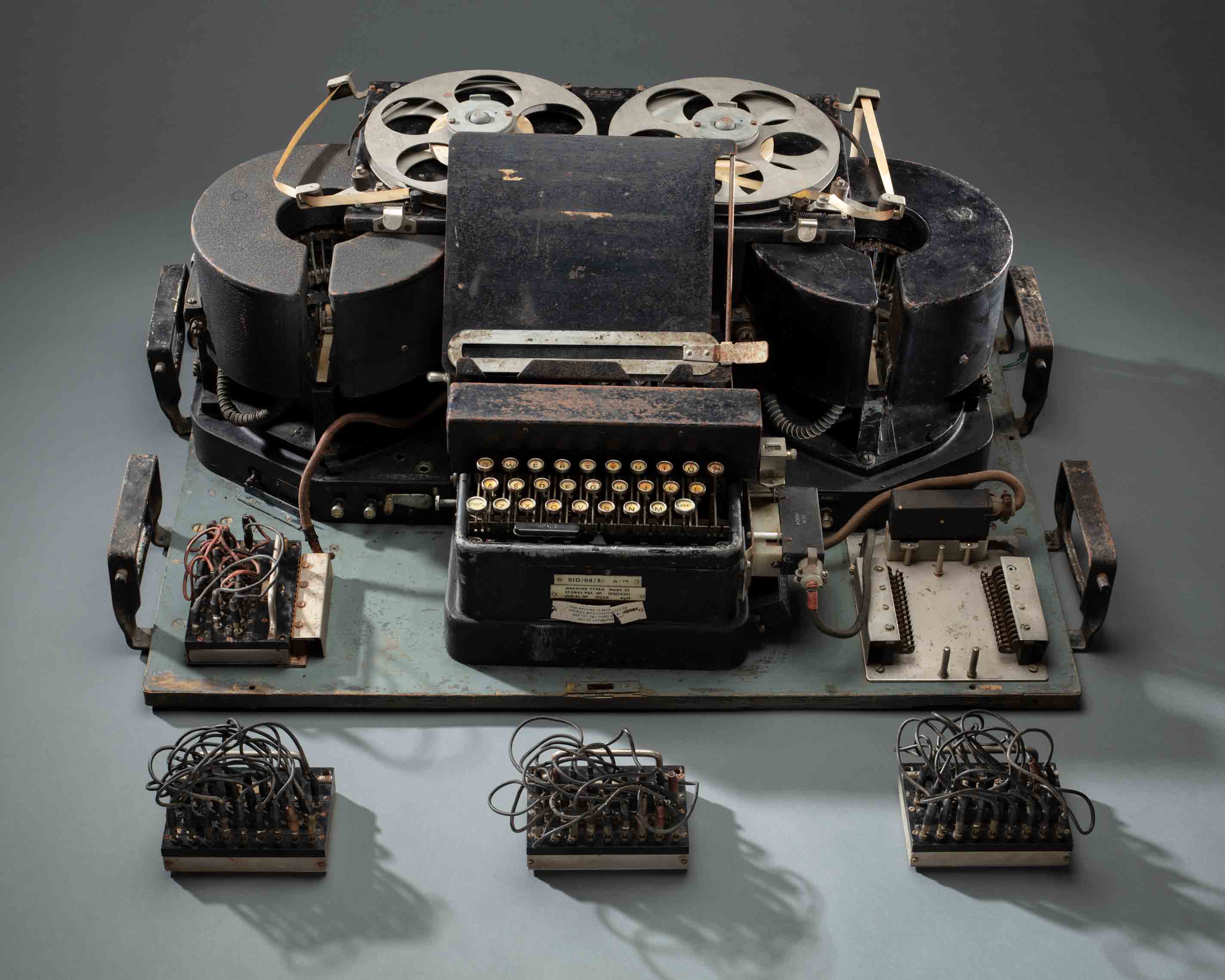 A Typex Mark 23 accompanied by three plug boards.