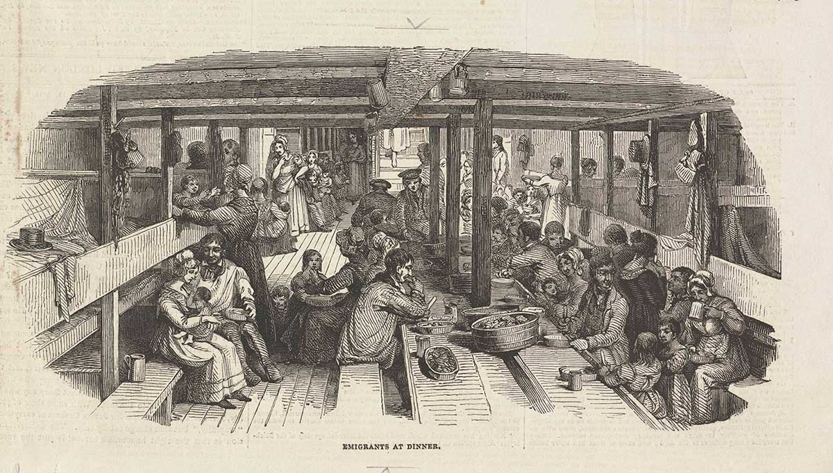 Drawing or print of an interior of a ship with a large group of men, women and children. They are sitting around long tables eating meals. Beds areas running parallel with the tables.