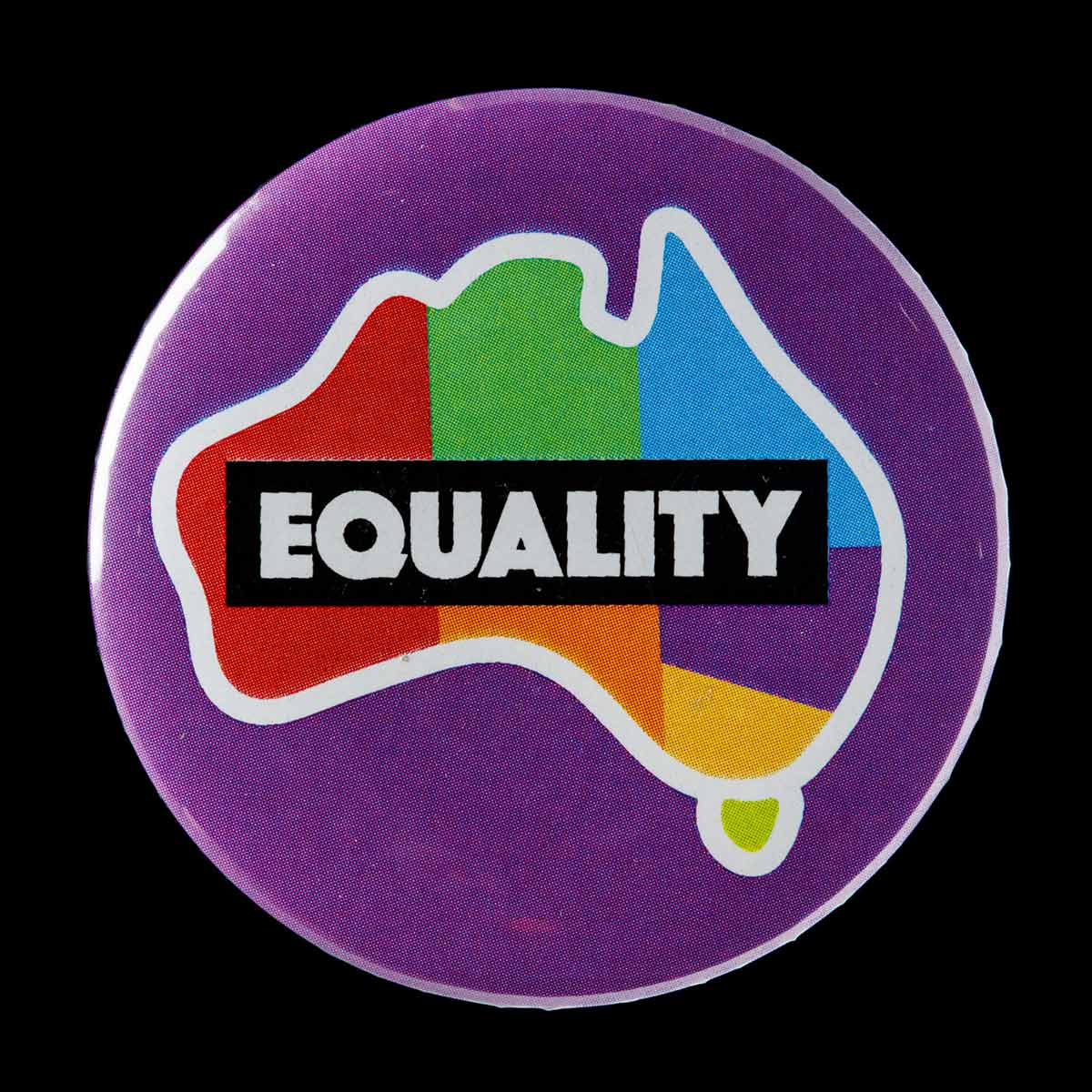 A round badge with a purple background. It features a map of Australia with each state and territory depicted in a different colour. The word 'EQUALITY' features centrally on the badge.