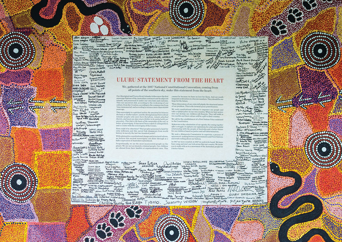The Uluru Statement from the Heart, with signatures of those who attended the National Convention. The surrounding artwork, by Rene Kulitja and other local artists (Charmaine Kulitja, Happy Reid and Christine Brumby), depicts Anangu stories (Tjukurrpa) about the creation of the country around Uluru
