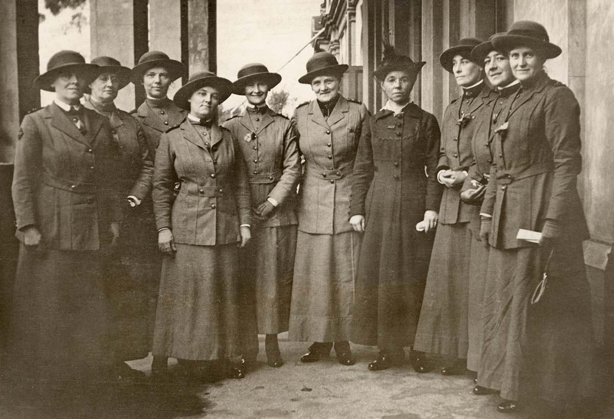 Black and white portrait photograph of a group of women in military uniforms.