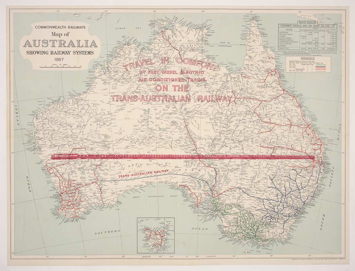 Map of Australia with a red stylised image of a train stretching from the east to west coasts. Printed over the top-end are the words ‘Travel in comfort by fast diesel electric air conditioned trains on the Trans-Australian Railway.