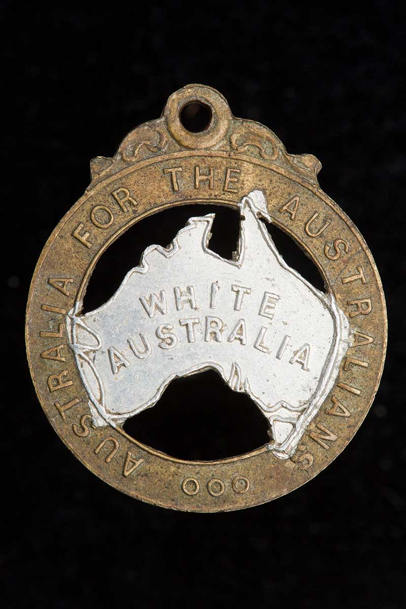 This 28mm-high badge has the words ‘Australia for the Australians’ stamped on the rim and the words ‘White Australia’ stamped on silver-painted representation of the Australian continent in the middle.