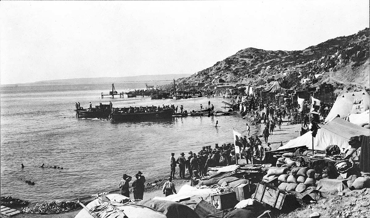 <p>Anzac Beach, Gallipoli, 1915. The beach packed with Australian soldiers and supplies with more arriving in small boats</p>
