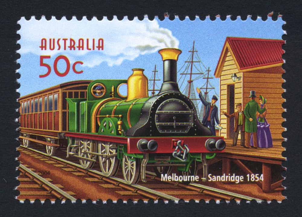 Colourful 50-cent stamp showing early steam engine at timber station with happy Victorian family on platform.