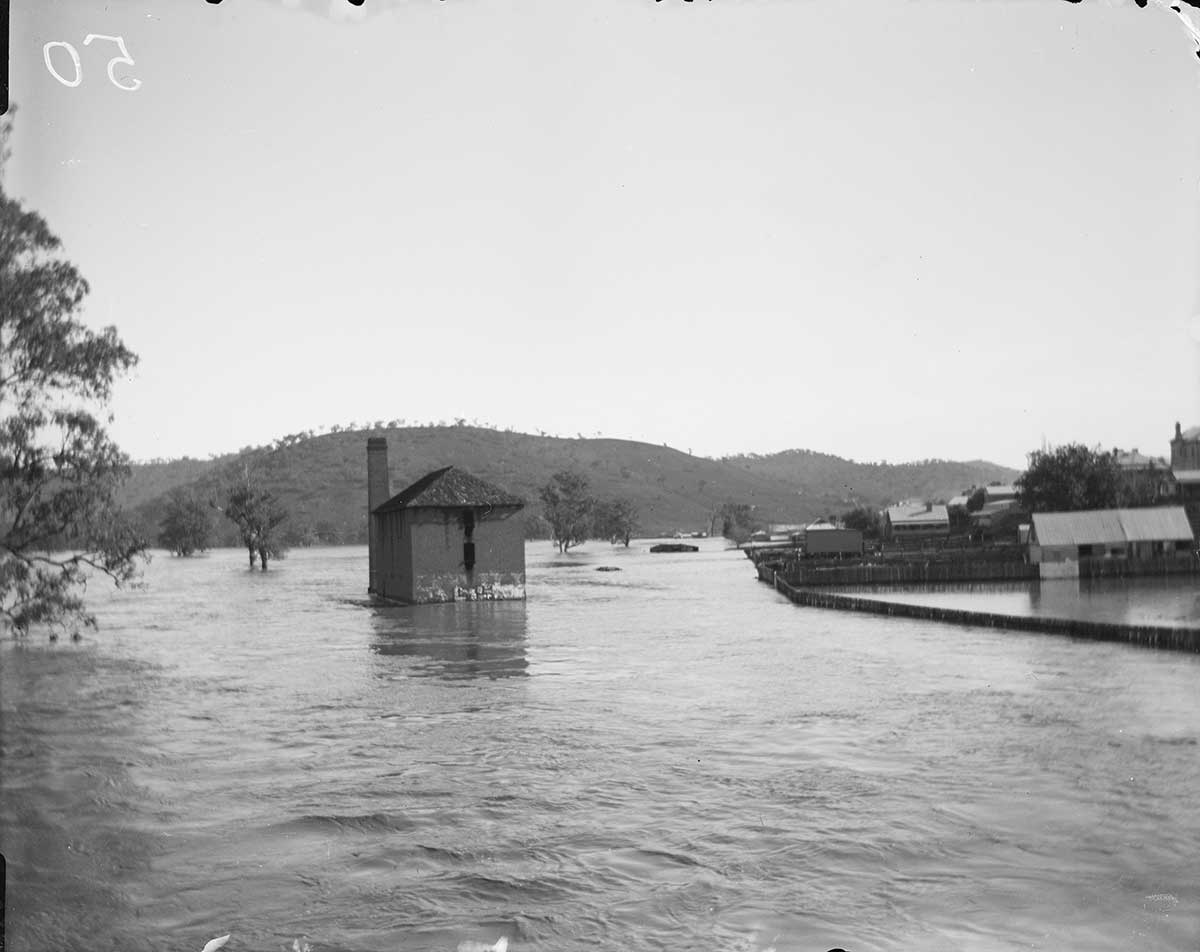 A flour mill surrounded by water.