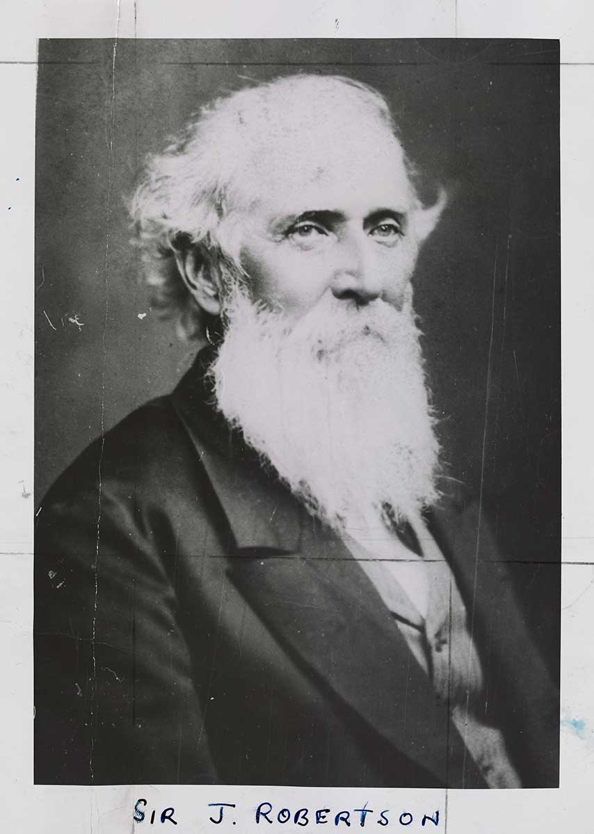 Black and white photograph of a man. Handwritten at the bottom is 'SIR J. ROBERTSON'.