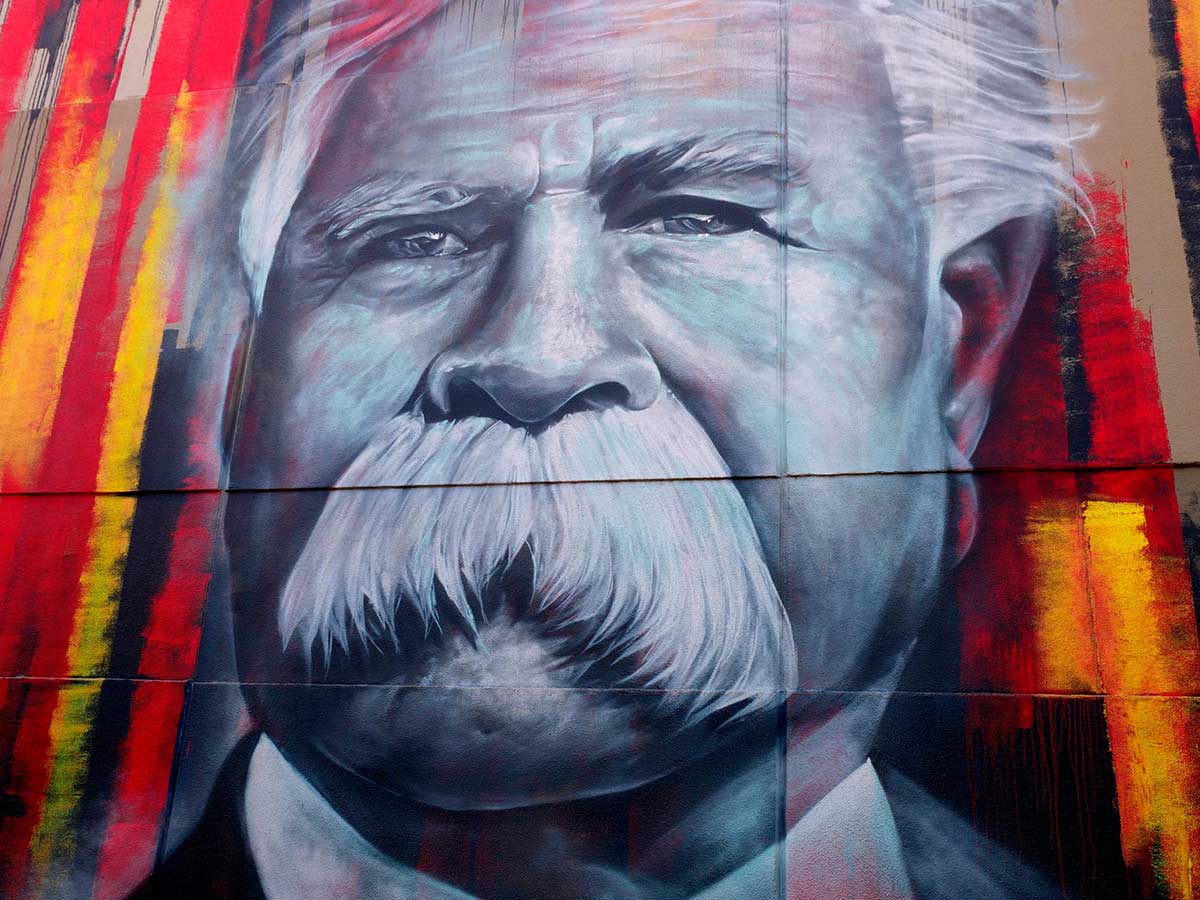 Wall mural depicting an elderly man with a large moustache.