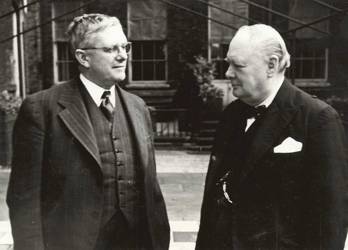Black and white photograph of two men in business or formal attire.