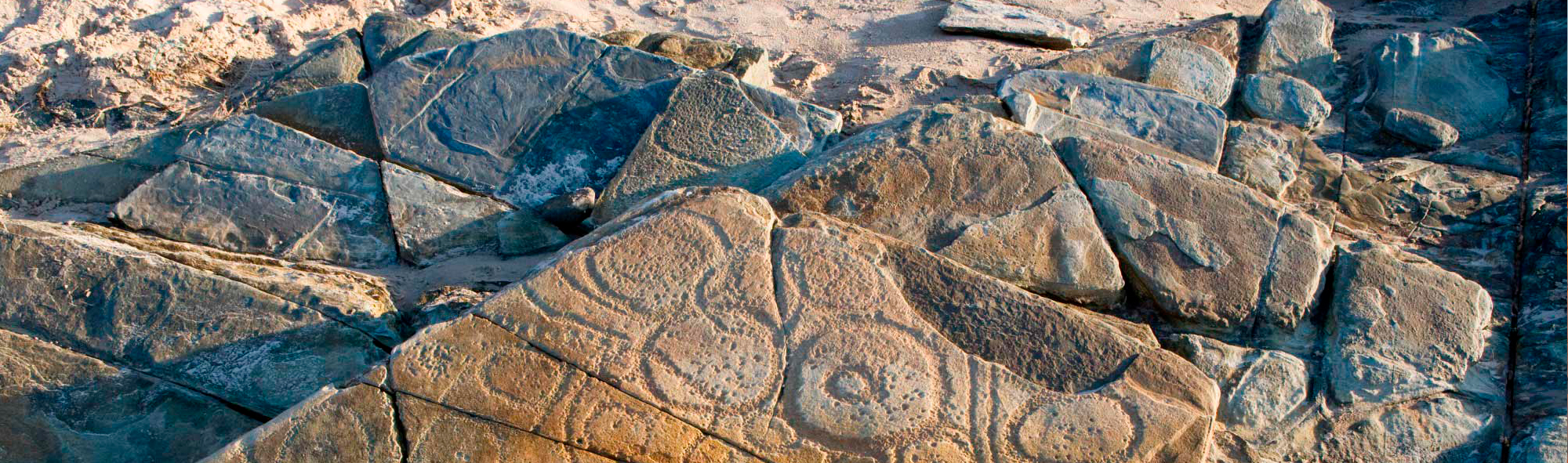 Rock formation with incised design.