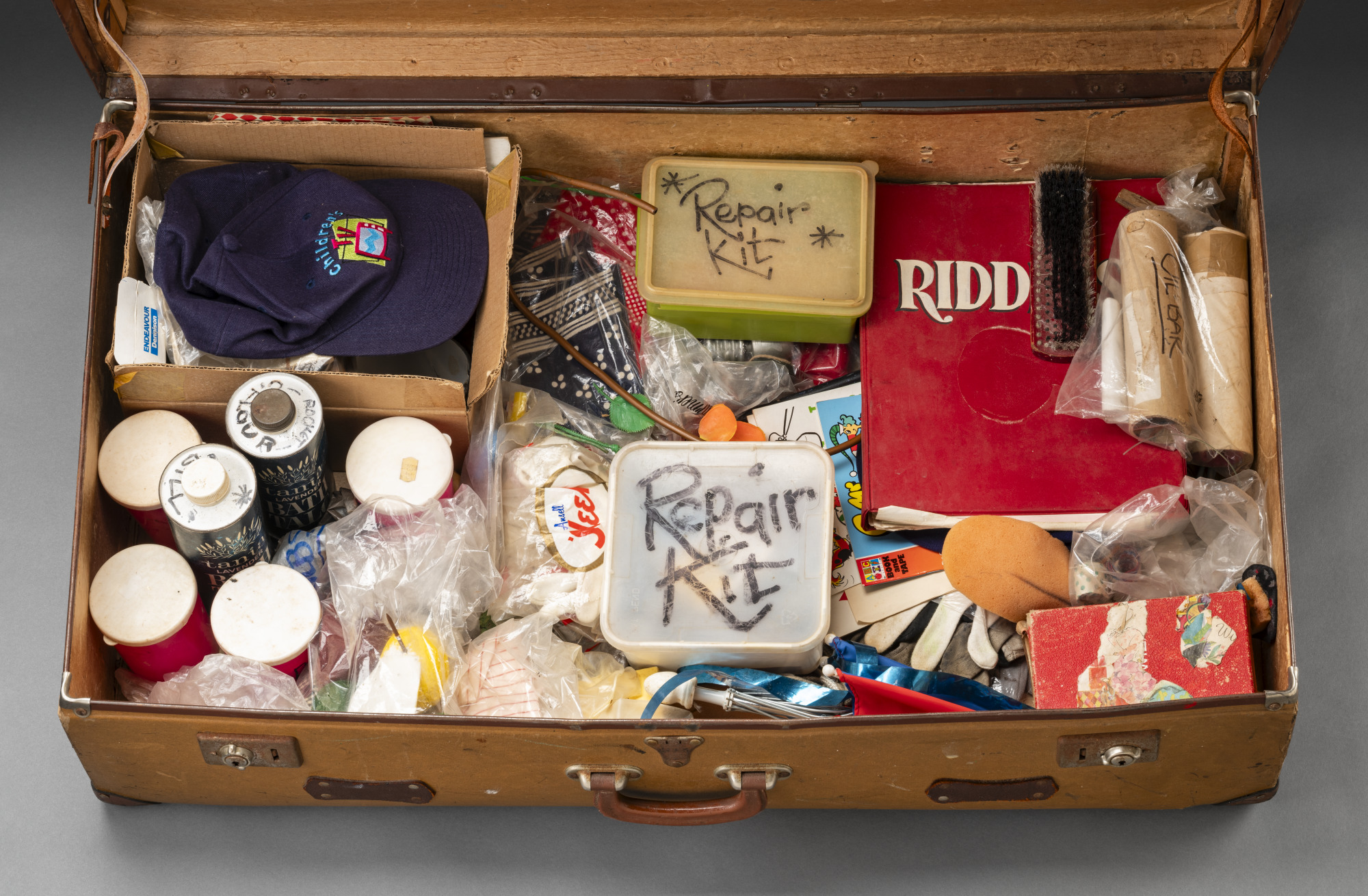 Suitcase containing repair kits and props taken by Norman to studio recordings 