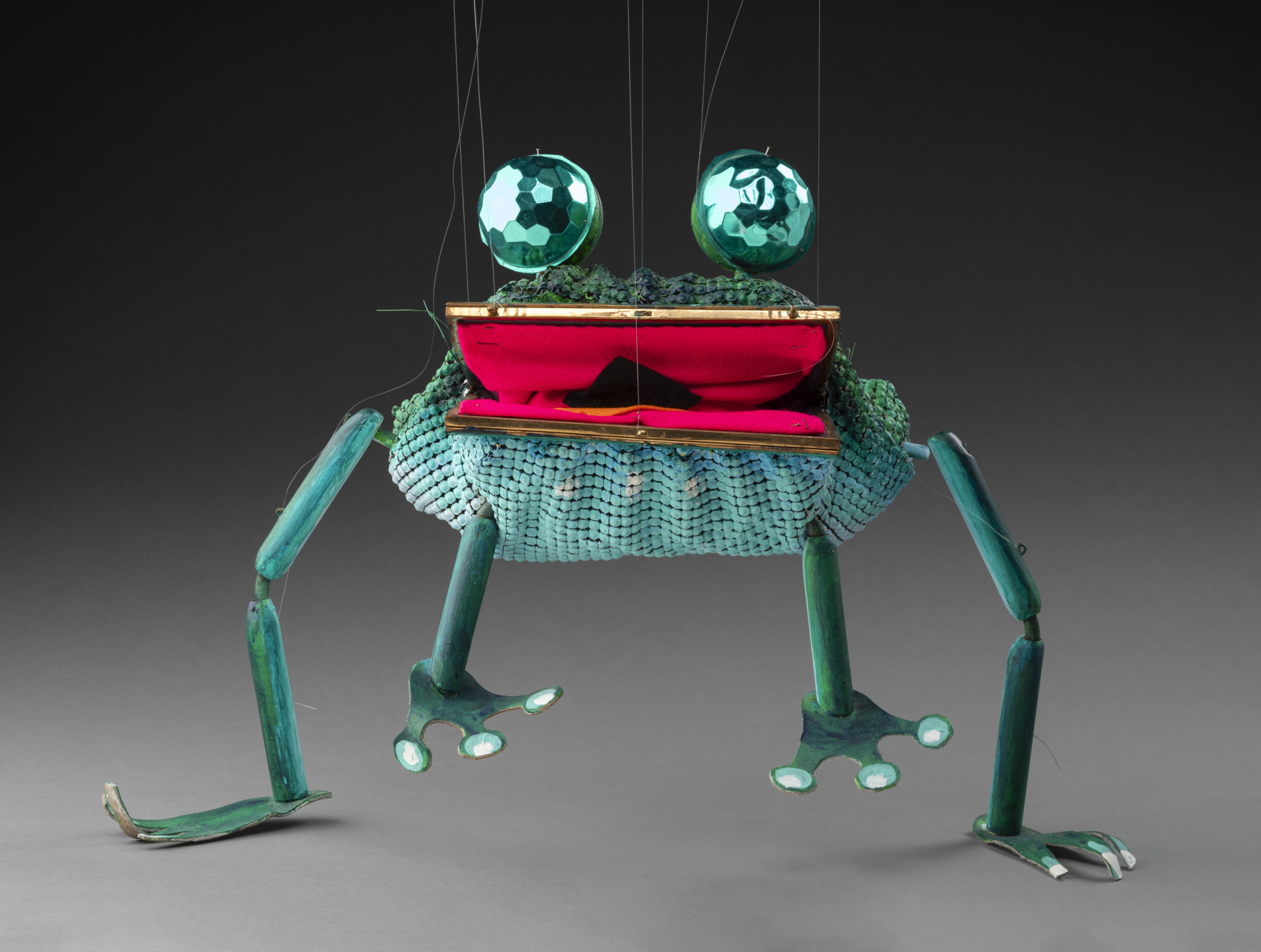 Frog marionette made from a handbag