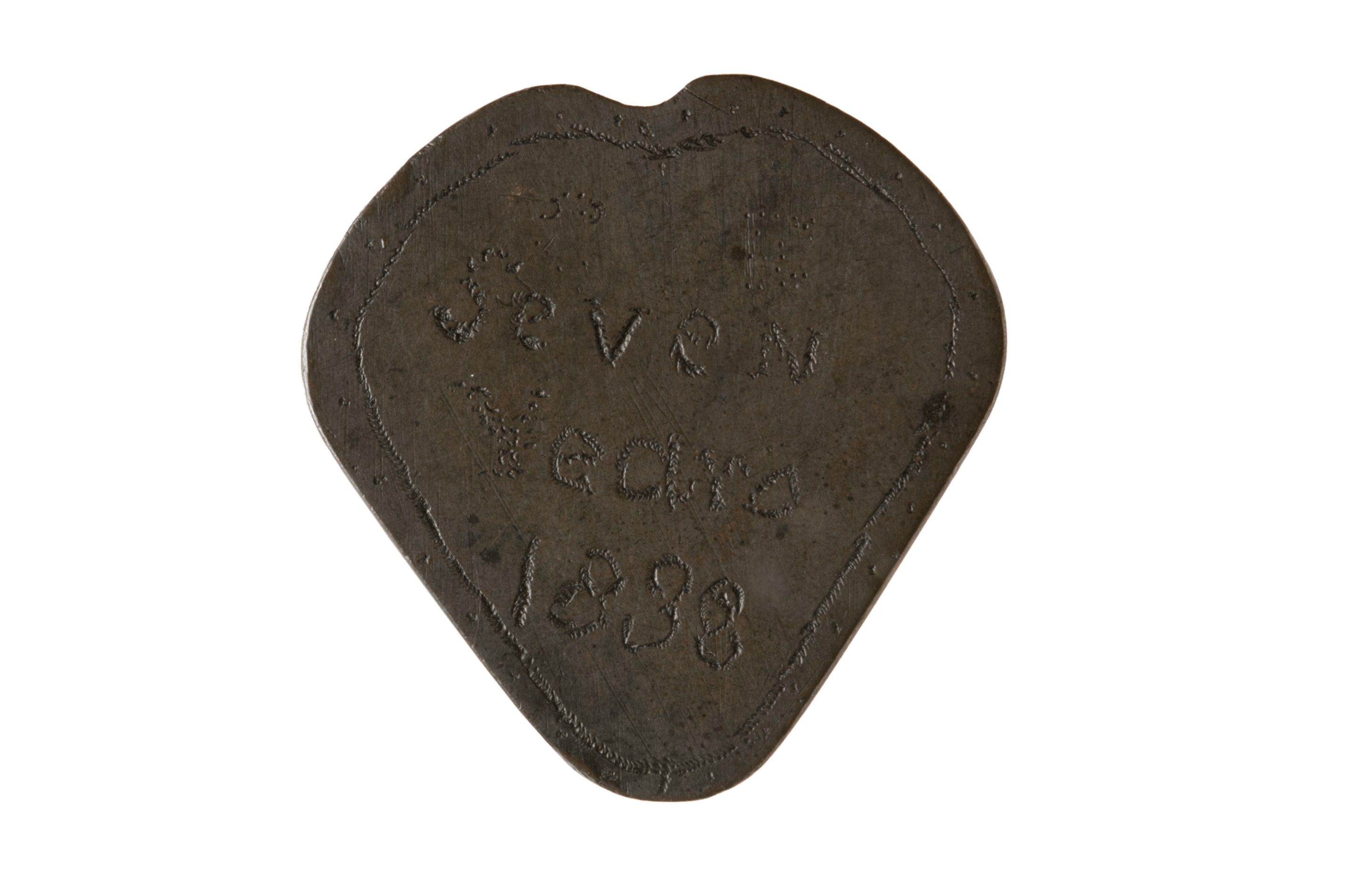 Token shaped into a rough heart shape, crudely engraved with a border and printed text:  Seven  Years  1838  Token shaped into a rough heart shape, crudely engraved with a stippled border and printed text:  J . M  Oct  22 