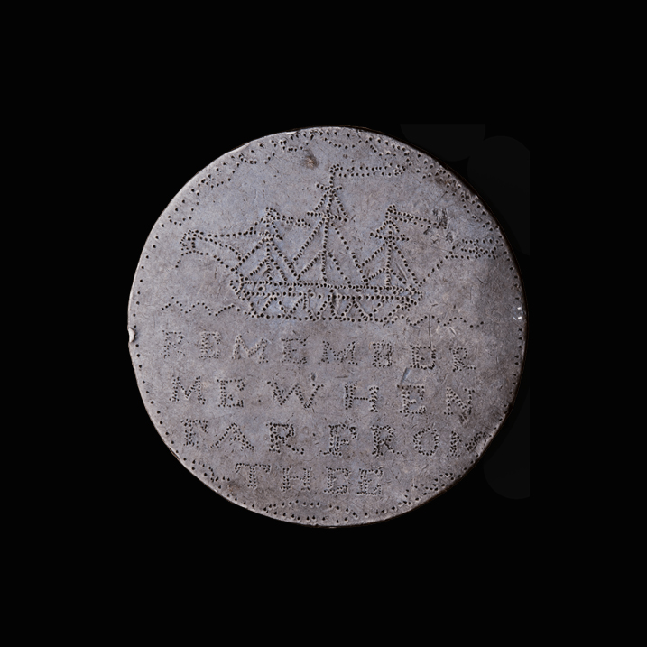 Token engraved with a border of stippled leaves and a shape at the top that could be a map, containing the initial:  C  Underneath are eight lines of stippled text:  PERKINS  AGED . 15  7 . YEARS . A  GIFT . TO . HIS  FATHER  R  PERKINS  1843   Token with stippled border and the stippled image of a ship. Underneath is the stippled text:  REMEMBER  ME WHEN  FAR FROM  THEE