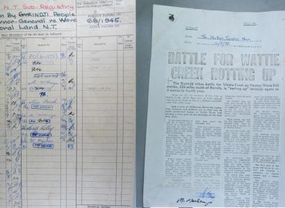 Photograph of two documents; one is a petition the other a photocopy of a newspaper article.
