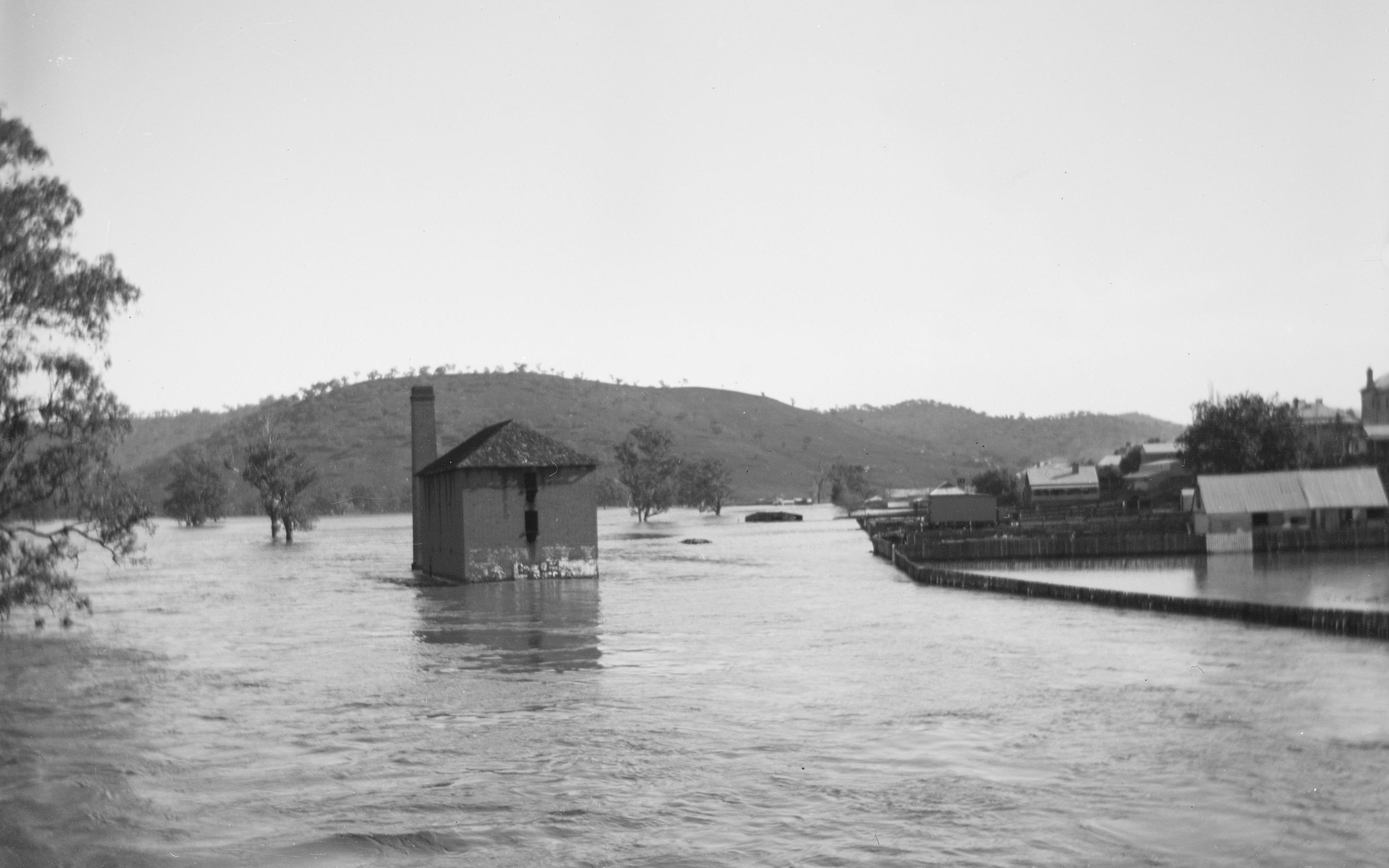 The flour mill surrounded by water during the 1900 flood in Gundagai, New South Wales. 